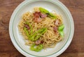 A dish of spaghetti on wooden table Royalty Free Stock Photo