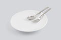 Dish spoon and fork isolated on white background, utensil for food, ceramic plate with empty. Royalty Free Stock Photo