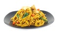 Dish of stir fried yellow noodles with meat and vegetable on white