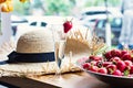 Dish with strawberries and champagne glasses on the table.