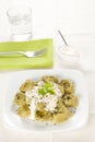 Dish of tortellini with cheese sauce