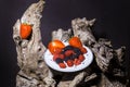 Dish on trunk of red fruits like strawberries, blackberries and raspberries