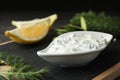 Dish of Tzatziki sauce with lemon slices, cucumber and dill Royalty Free Stock Photo