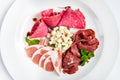 Dish of various types of meat-cutting on plate. Royalty Free Stock Photo