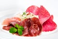 Dish of various types of meat-cutting on plate. Royalty Free Stock Photo