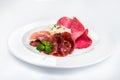 Dish of various types of meat-cutting on plate. Royalty Free Stock Photo