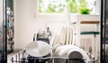 Dish washing machine. Inside an open dishwasher, view to kitchen. Clean plates, utensils, cutlery and pot in washer rack. Royalty Free Stock Photo