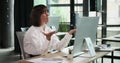 Disheartened Businesswoman at Computer in Office