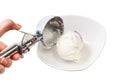 disher scoop puts a ball of ice cream in bowl Royalty Free Stock Photo