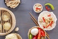 Dishes of Chinese cuisine in assortment. Steam dumplings, noodles, salads, vegetables, mushrooms, seafood. Royalty Free Stock Photo