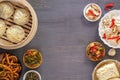 Dishes of Chinese cuisine in assortment. Steam dumplings, noodles, salads, vegetables, mushrooms, seafood. Royalty Free Stock Photo