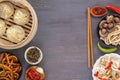 Dishes of Chinese cuisine in assortment. Steam dumplings, noodles, salads, vegetables, mushrooms, seafood. Royalty Free Stock Photo