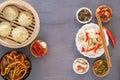 Dishes of Chinese cuisine in assortment. Steam dumplings, noodles, salads, vegetables, mushrooms, seafood. Royalty Free Stock Photo