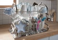 Dishes drying on a metal dish rack Royalty Free Stock Photo