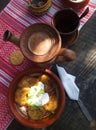 Dishes on the table, dishes on an embroidered tablecloth, a laid dining table, lunch outside.