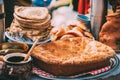 Dishes of the traditional Belarusian cuisine - pie, pancakes and honey.