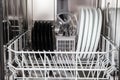 Dishes after washing in modern dishwasher machine