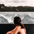 disheveled and unfocused caucasian girl from behind observing the lake, trees and mountains from inside a moving boat Royalty Free Stock Photo