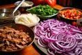 dishing up colorful pepper strips, onions, and beef fajita