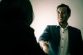 Dishonest business man is giving a hand shake with devil look Royalty Free Stock Photo