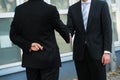 Dishonest Businessman Shaking Hands With Partner