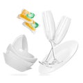 Dishwasher pods and clean tableware flying on white background