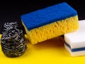 Dishwashing concept. On a black background, different washcloths and scrubbers for washing dishes