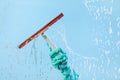 Dishwashing gloves and cleaning wiper isolated on blue background