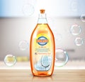 Dishwashing liquid product. Plastic container with label design and soap bubbles Royalty Free Stock Photo