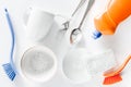 Dishwashing liquid, sponge, brush and tableware on white background top view Royalty Free Stock Photo