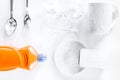 Dishwashing liquid, sponge and tableware on white background top Royalty Free Stock Photo