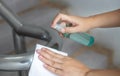 disinfect, sanitize, hygiene care. cleaning staff using alcohol spray on banister and frequently touched area for cleaning