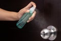 Disinfect, sanitize, hygiene care. inject alcohol spray on door knob and frequently touched area for cleaning and disinfection