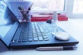 Disinfectant bottles on a black laptop in the office. Sanitizer is generally hygiene in the context of a coronavirus pandemic