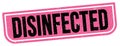 DISINFECTED text written on pink-black stamp sign