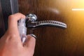 Disinfecting door knob. Disinfection and cleaning of doorhandles. Germs, bacteria, Covid-19, Coronavirus pandemic