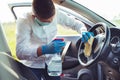 Disinfecting inside car, wipe clean surfaces that are frequently touched, prevent infection.