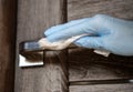 Disinfecting surfaces from bacteria or viruses, hand cleaning door handle with disinfectant against coronavirus covid-19. Hand in Royalty Free Stock Photo