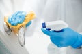 Disinfection and cleaning door handles of house from infection with virus and microbes in biochemical suit. Coronavirus