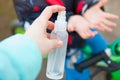 Disinfection of hands and vehicles while cycling on the street. Sanitizer close-up.