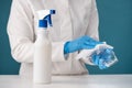 Disinfection with a solution from a spray bottle by wiping medical goggles