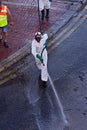 Disinfectors in protective clothing during disinfection on public place in Malta
