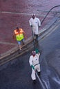 Disinfectors in protective clothing during disinfection on public place in Malta