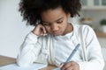 Disinterested in study african little schoolgirl do homework at home