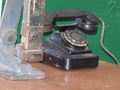 Disk dialer of old vintage black phone close-up