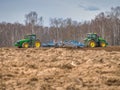 Disking soil with a tractor in Central Russia in the spring season. Royalty Free Stock Photo