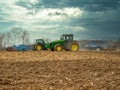 Disking soil with a tractor in Central Russia in the spring season.