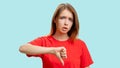 Dislike gesture annoyed skeptic woman thumb down