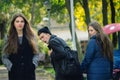 Disloyal man walking with girlfriend and looking amazed at another seductive girl Royalty Free Stock Photo