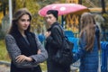 Disloyal man walking with girlfriend and looking amazed at another seductive girl Royalty Free Stock Photo